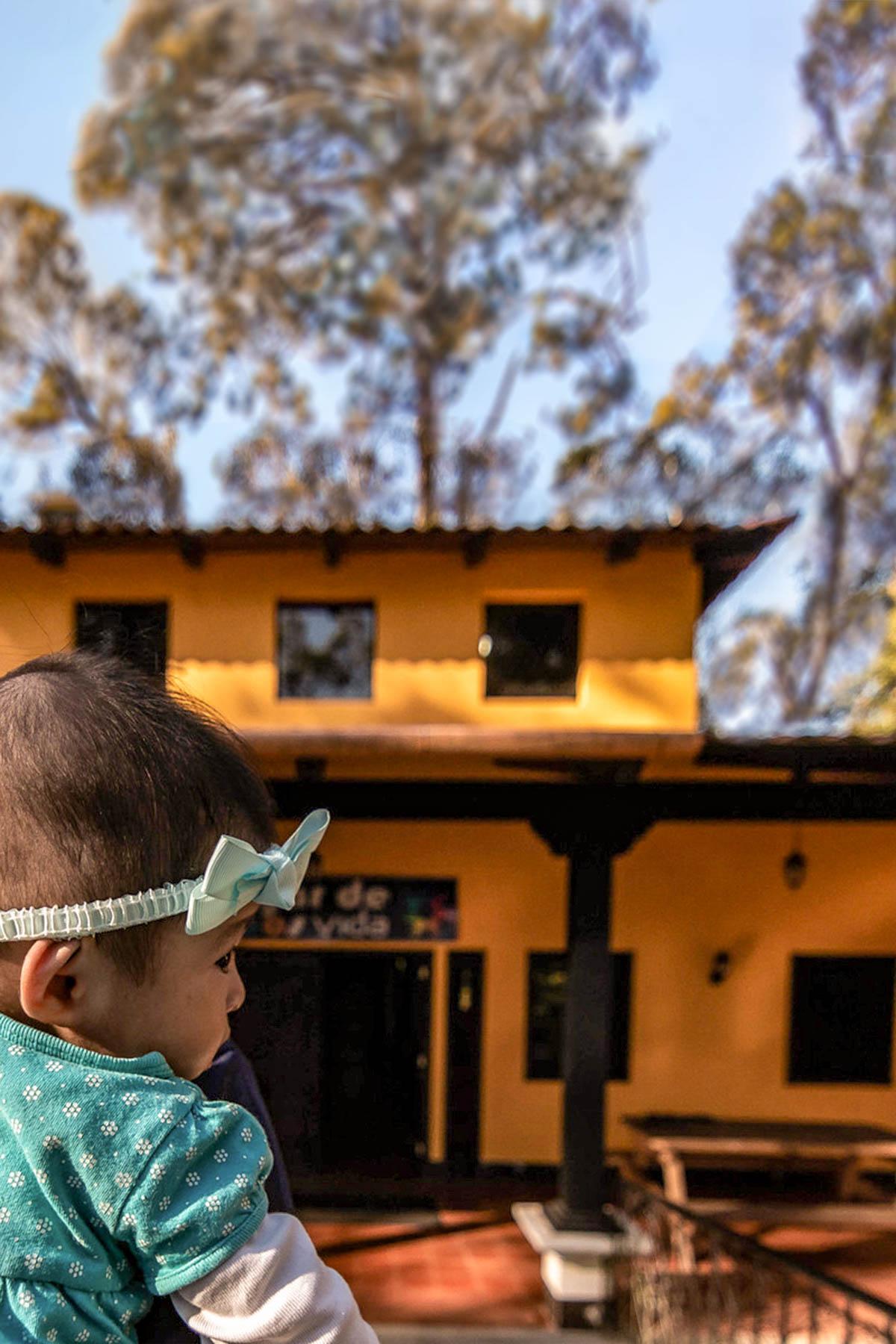 Baby in front of Vida children's home