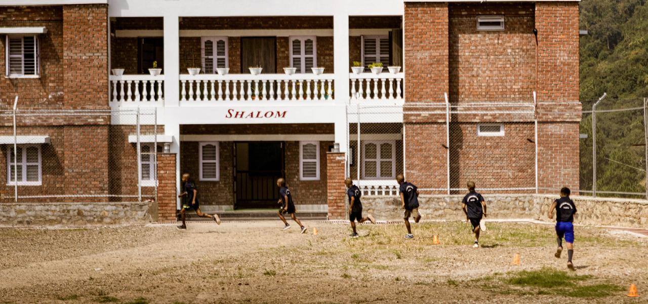 Children playing in front of the dorm