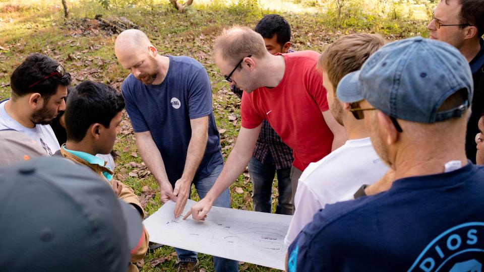 EMI team looking at a masterplan