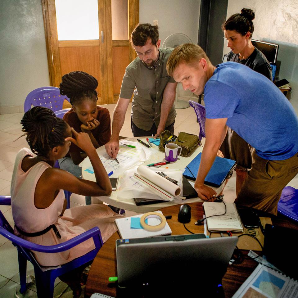 Team looking over drawings