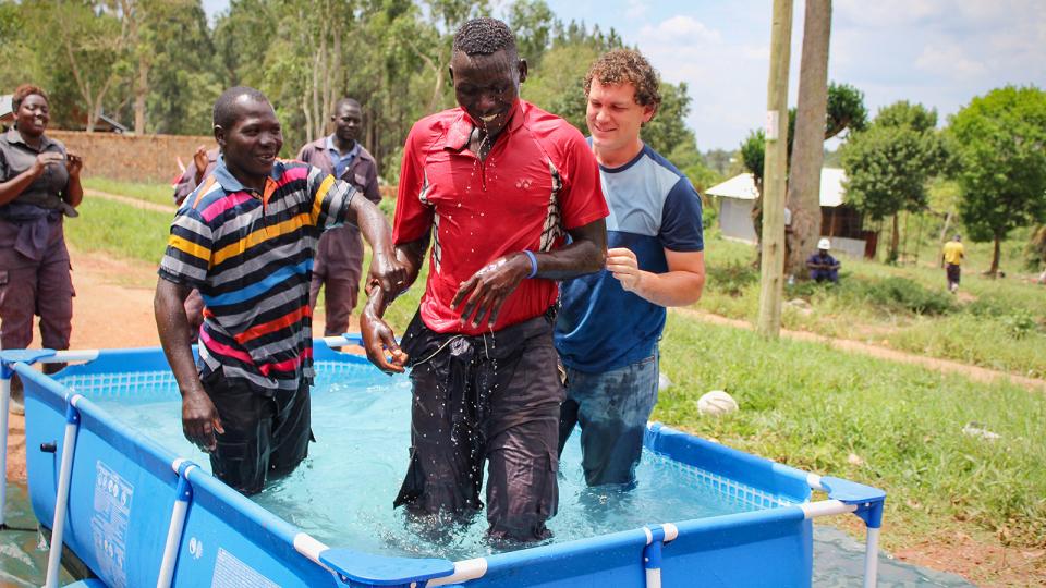 Obong Denis being baptized