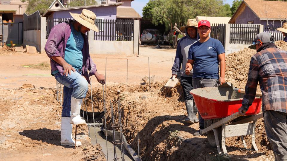 Workers working on the foundation trench