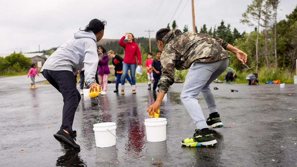 Youth with water buckets