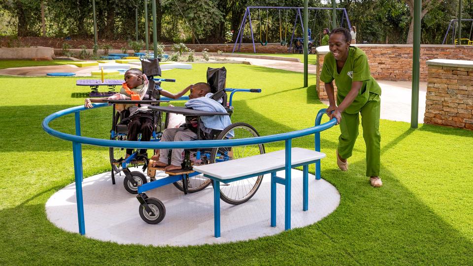 Nanny with children at the wheelchair spinner