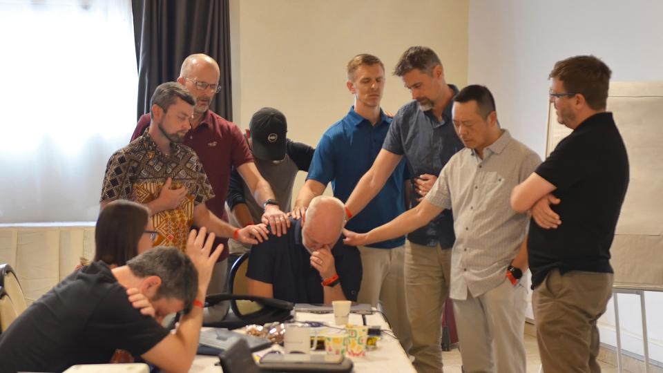 EMI leadership praying for John