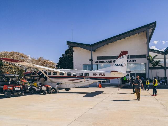 Team boarding a plane in Haiti