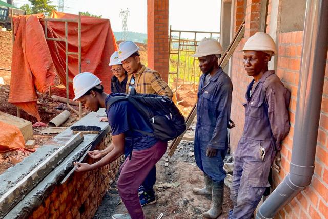 Workers exchanging ideas at a construction site